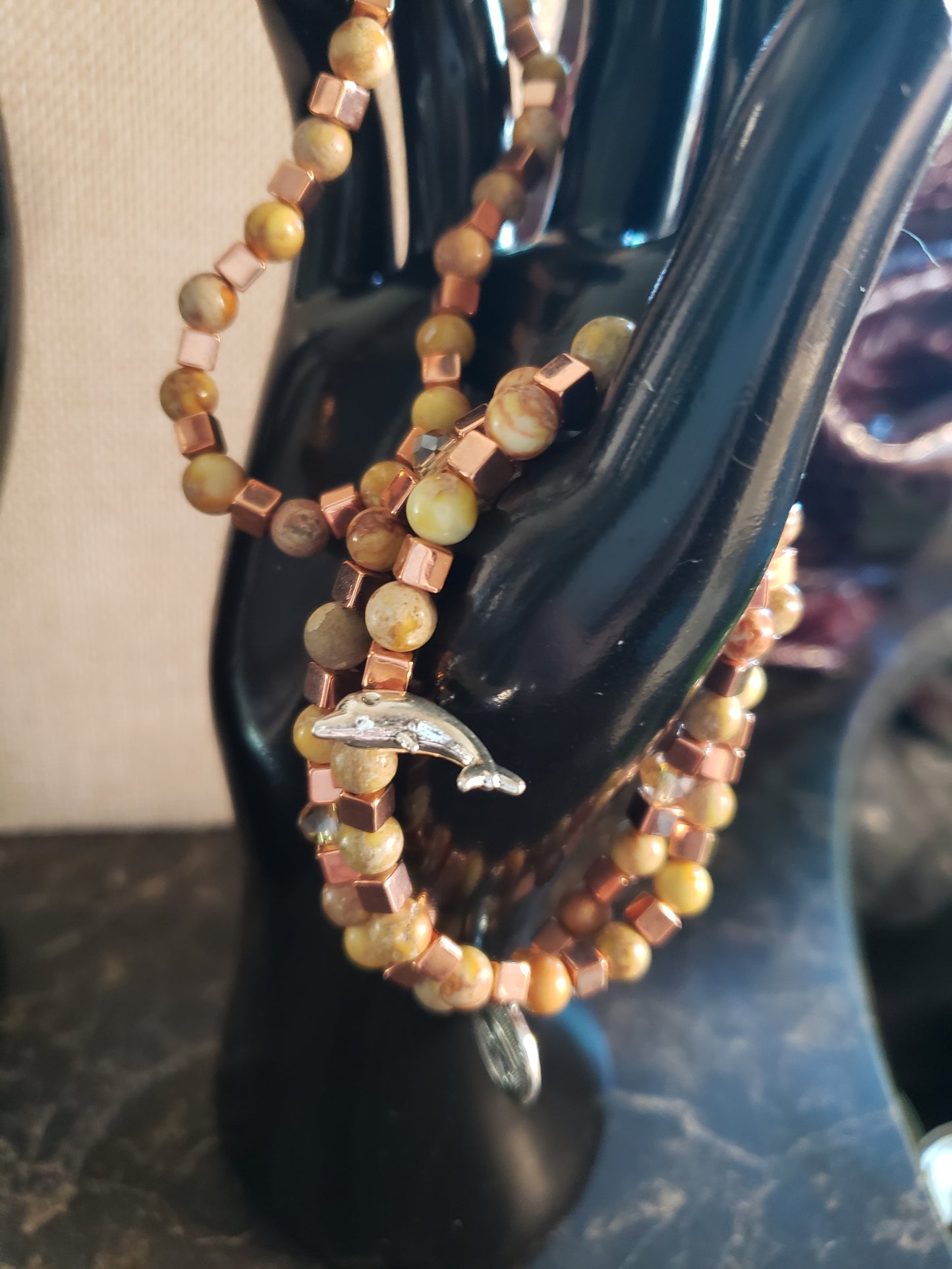 Earth tone stretchy bracelet with copper accents and yellow agate beads