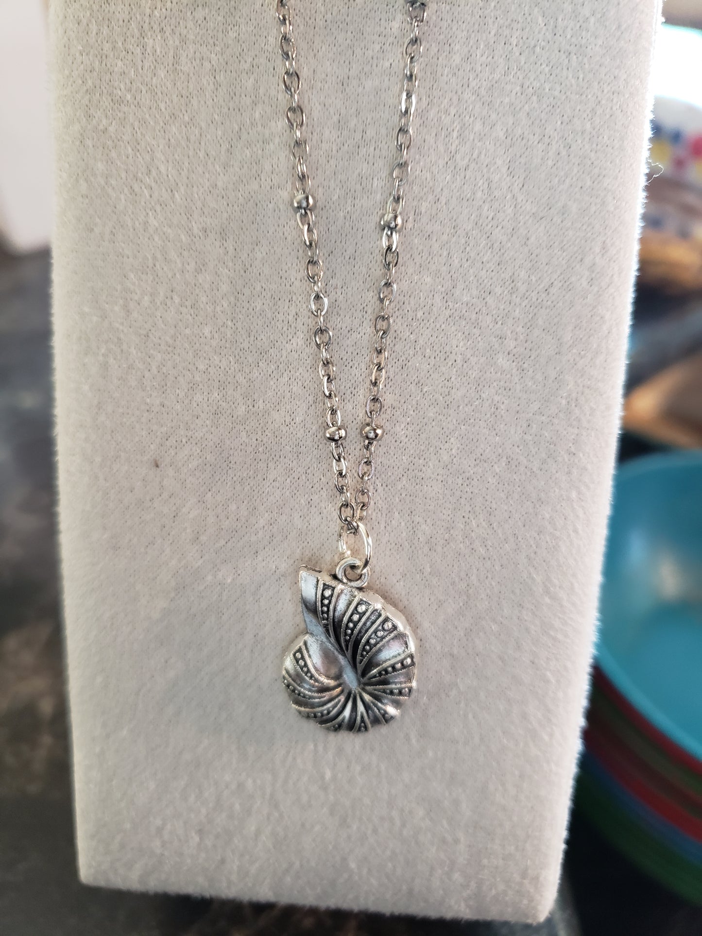Silver chain with spiral sea shell