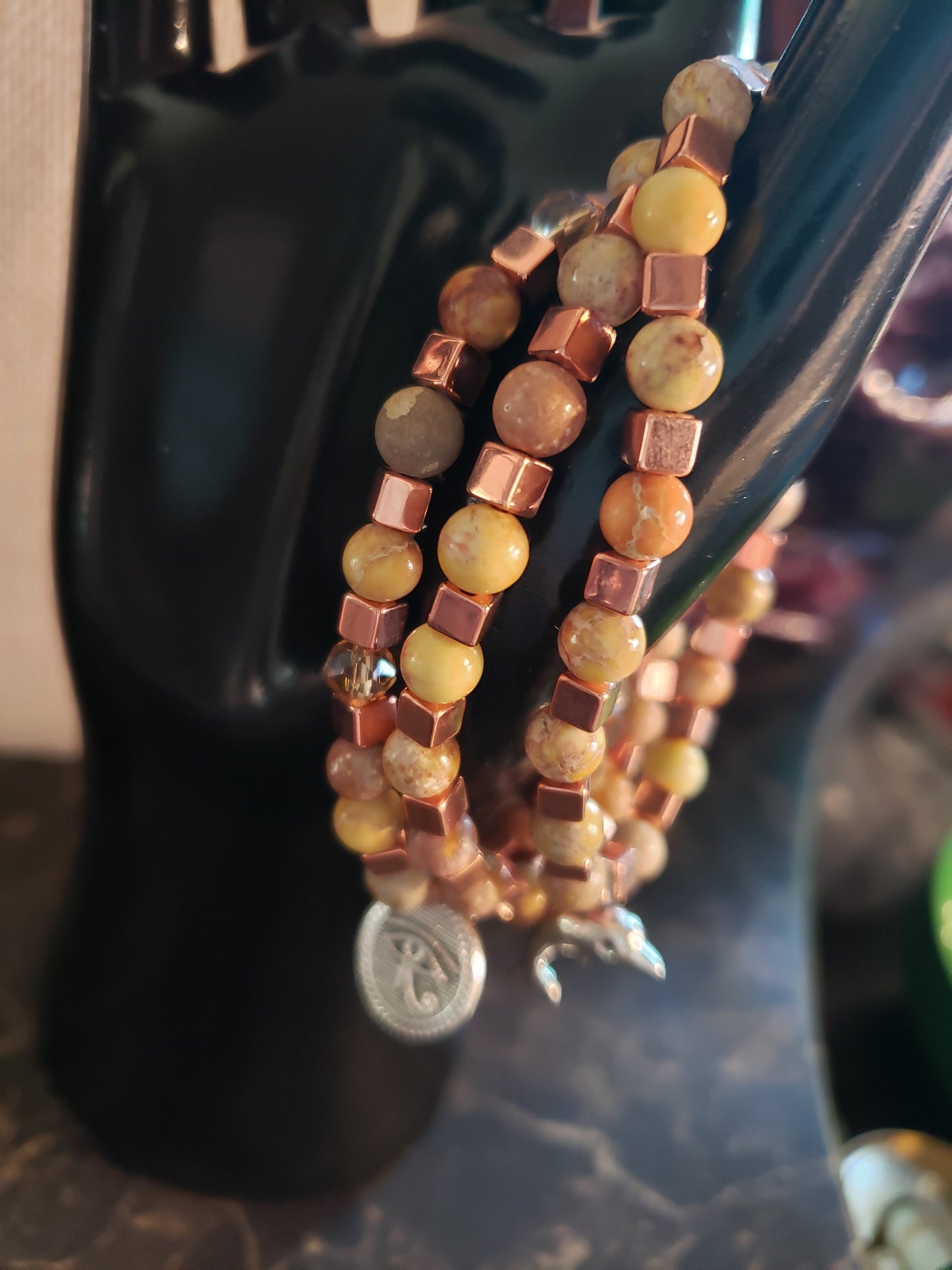 Earth tone stretchy bracelet with copper accents and yellow agate beads