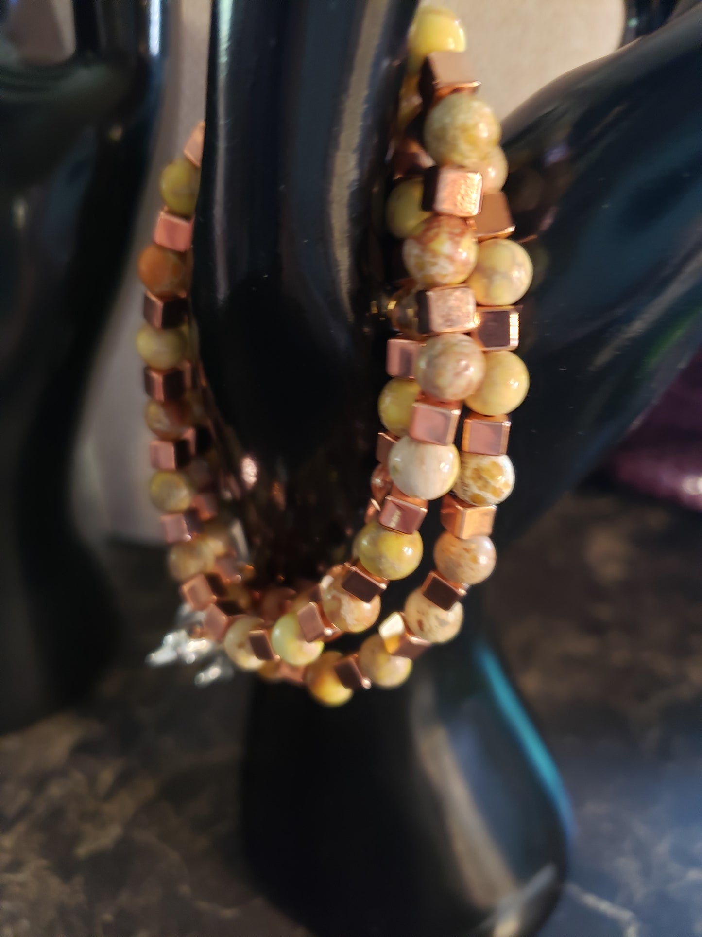 Earth tone stretchy bracelet with copper accents and yellow agate beads