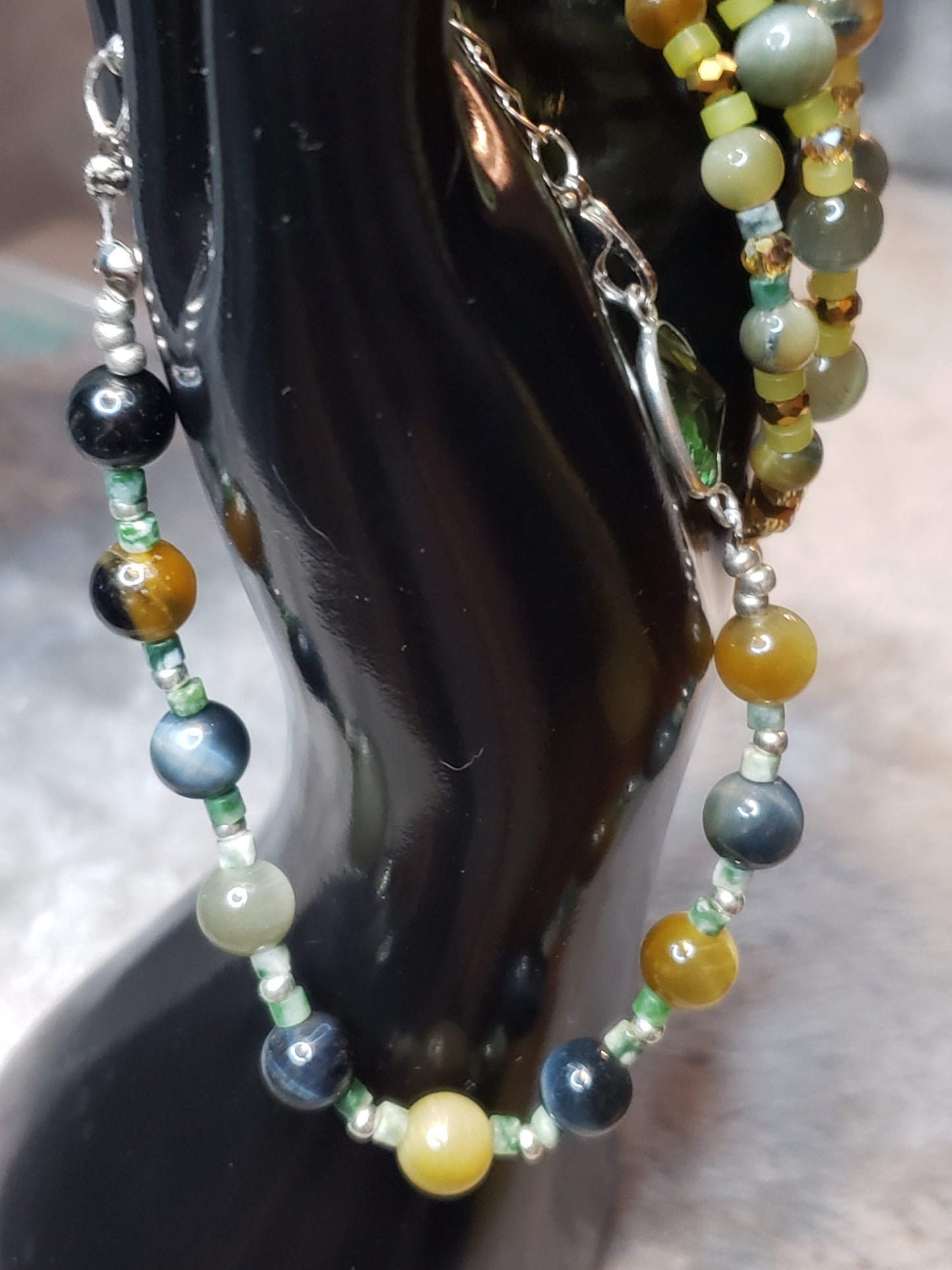 Exquisite design 4 bracelets with light Jade, Topaz and Tiger eye  SOLD